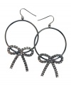 Sweeten up everyday hoops with this version by GUESS. Dark, hematite-plated hoops adorned with crystallized bows. Earrings crafted from mixed metal. Approximate drop: 2 inches.