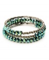 Vivid and vibrant. Gorgeous green-hued beads accented by glittering crystals make a stunning statement on this coil bracelet from Kenneth Cole New York. Crafted in hematite tone mixed metal. Approximate length: 8 inches.