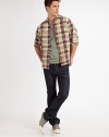 A clean, saturated wash that dresses up or down with ease in soft, raw denim for a personalized fit and feel. Five-pocket style Button fly Inseam, about 34 Cotton Machine wash Made in USA 