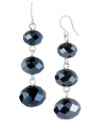 Getting a bead on style, three times over. Kenneth Cole New York's drop earrings are crafted from silver-tone mixed metal with faceted blue cherry beads adding a cool touch. Approximate drop: 2 inches.