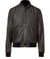 Stylish, blouson style leather jacket in dark brown, washed leather - From the Italian design duo Dolce & Gabbana - Small stand collar, two flap pockets, two-way zipper - Windproof, ribbed wool cuffs on the sleeves and hem - Cool and sexy - Pair with casual jeans and a T-shirt or a pullover and sneakers