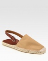 Classic espadrille style with neutral canvas upper and adjustable leather slingback strap.Canvas upperRubber soleImported