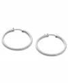 Go full-blitz with these glitzy hoop earrings from Fossil. The classic design is amped up with clear pave crystal accents. Crafted in polished stainless steel. Approximate diameter: 1-3/8 inches.