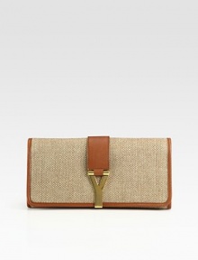 A slim continental bag crafted from light weight linen and rich leather trim.Flap snap closureOne inside open pocketLinen lining11W X 7H X 1¾DMade in Italy A slim continental bag crafted from light weight linen and rich leather trim.Flap snap closureOne inside open pocketLinen lining11W X 7H X 1¾DMade in Italy