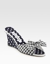 Vivid polka dots add charm to this mule wedge mixed with a classic gingham print and fine leather trim. Self-covered wedge, 3 (75mm)Fabric and grosgrain ribbon upper with leather trimGrosgrain liningLeather solePadded insoleMade in Italy