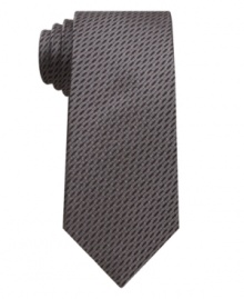 With a natty throwback pattern, this houndstooth skinny tie from Bar III is instantly dapper. With a natty throwback pattern, this houndstooth skinny tie from Bar III is instantly dapper.