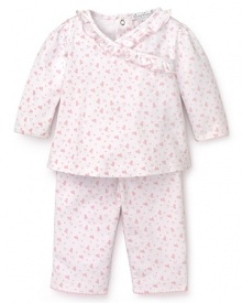 Rendered in heart print Pima cotton, this pink and white Kissy Kissy set features a ruffle trim top and basic pants. Rendered in heart print Pima cotton, this pink and white Kissy Kissy set features a ruffle trim top and basic pants.