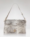 This Tory Burch clutch does evening with an edge. Crafted of rabbit fur with leather trims, it's a look-maker after-hours.