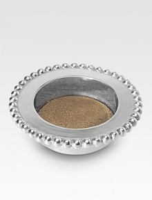 The perfect gift for the wine connoisseur in your life, handcrafted in sandcast aluminum with string-of-pearls detail and a buffed, brilliant finish. Cork inlay Recycled aluminum 1¾H X 6½ diam. Imported 