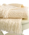 Beat the cold with this super-soft throw from Lauren by Ralph Lauren. Features a boucle knit in a cream hue for a cozy addition anywhere in your home. Finished with a 3 fringe.