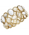 Freshen up with a clean white color palette. Charter Club's chic cluster bracelet features bright white plastic beading set in gold tone mixed metal. Bracelet stretches to fit wrist. Approximate diameter: 2-1/4 inches.