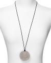 Delicately decked in crystals, MICHAEL Michael Kors' disc shaped pendant brings the modern glamour. This statement design looks perfect layered over a crisp white blouse or something cocktail dressier.