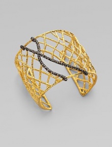 A cuff with delicate branches accented in Swarovski crystals. GoldtoneRuthenium platedSwarovski crystalsDiameter, about 2½Width, about 2 Slip-on styleImported A cuff with delicate branches accented in Swarovski crystals. GoldtoneRuthenium platedSwarovski crystalsDiameter, about 2½Width, about 2 Slip-on styleImported