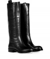 Timeless gets a kick of contemporary cool in Marc by Marc Jacobs edgy leather boots, finished with a chunkier sole for that trend favorite moto feel - Rounded toe, embossed leather logo patch, stitched welt, stacked leather heel, pull-on style - Wear with favorite skinnies and chunky knit pullovers, or over opaque tights and edgy modern separates