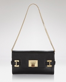 A versatile MICHAEL Michael Kors clutch with glamazon goldtone hardware and organized interior pockets. A versatile MICHAEL Michael Kors clutch with glamazon goldtone hardware and organized interior pockets.