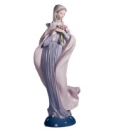 Cloaked in soft pastels and clutching a pink bouquet, the Lady with Flowers figurine from Lladro has an air of quiet elegance in handcrafted porcelain.