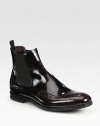 Leather Chelsea boot design with wing-tip detail and side goring.Leather upperLeather liningRubber soleMade in Italy