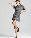 Update the menswear trend in a DIANE von FURSTENBERG shirt dress, touting cuffed short sleeves, a buckle-cinched waist and a femme pleated skirt.