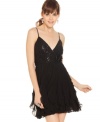 How stunning! Rows of soft ruffles balance the sequin bodice of a B. Darlin dress that's full of dark whimsy.