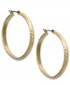 Versatile hoops are a must-have. These Jones New York earrings feature a large hoop emblazoned with a diamond-cut pattern. Crafted in worn gold tone mixed metal. Approximate diameter: 1-1/2 inches.