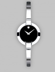 Slim and sleek stainless style is accented with a black museum dial. Quartz movement Round face 24mm Stainless steel band Made in Switzerland