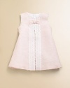 Airy and lovely linen is adorned with a pretty bow and embellished with front lace detail.Jewel necklineSleeveless with scalloped detailingBack buttonsA-line silhouette56% linen/44% cottonMachine wash coldImported Please note: Number of buttons may vary depending on size ordered. 
