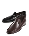 Handsome slip-on dress mocassins with tapered toe. Smooth, polished leather with leather lining and insole. Ornamental metal bit across foot.
