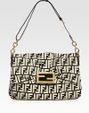 Signature canvas design crafted in a slouchy shape with a center goldtone logo clasp. Chain and leather adjustable shoulder strap, 12-14 dropMagnetic front-flap closureOne inside zip pocketLinen lining13½W X 8½H X 2DMade in Italy