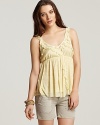 Add a dash of romance to your summer staple repertoire with this lightly printed crochet top from Free People.