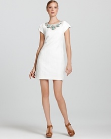 An opulently beaded neckline means you can keep jewelry to a minimum with this charming Laundry by Shelli Segal jacquard dress. An opulently beaded neckline means you can keep jewelry to a minimum with this charming Laundry by Shelli Segal jacquard dress.