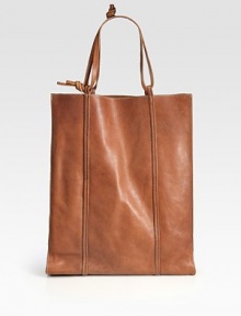 Topstitched leather carryall is endlessly adaptable, with an adjustable strap that lengthens when you need it most.Double top handles, 8½ to 14 drop Contrast topstitching No closure One inside zip pocket One inside open pocket Leather lining 4¼W X 17½H X 14D Made in Italy Topstitched leather carryall is endlessly adaptable, with an adjustable strap that lengthens when you need it most.Double top handles, 8½ to 14 drop Contrast topstitching No closure One inside zip pocket One inside open pocket Leather lining 4¼W X 17½H X 14D Made in Italy