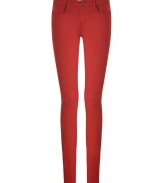 Skinny jeans in a fiery red modal-cotton blend - Classic five-pocket design features short zip fly and single-button closure - Flattering back pockets and subtle stretch create a sexy look - Pair with a silk blouse, over-sized cardigan and booties