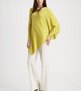 Elegant angles and diagonal lines create drama in a silk-blend sweater with one draped cape side.Asymmetrical diagonal necklineOne long fitted sleeve, one wide draped cape sleeveAsymmetrical scarf hem in front, shorter even hem in back55% silk/45% cottonDry cleanImported Model shown is 5'9½ (176cm) wearing US size Small. 