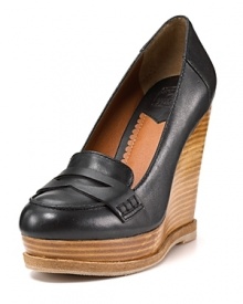 Classic penny loafers grow up with a boost from stacked wooden wedges for A+ style. By Lucky Brand. Classic penny loafers grow up with a boost from stacked wooden wedges for A+ style. By Lucky Brand.