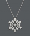 Warm your soul on a cold winter's day. This unique snowflake pendant features a six-prong design with glittering round-cut diamond accents. Necklace crafted in 14k white gold. Approximate length: 18 inches. Approximate drop: 3/4 inch.
