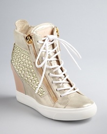 Outrageous style meets athletic fashion in blinged-out Giuseppe Zanotti wedge booties, studded with glittering golden Swarovski crystals. The sneaker heel is back, on wearable wedges. Outrageous style meets athletic fashion in blinged-out Giuseppe Zanotti wedge booties, studded with glittering golden Swarovski crystals. The sneaker heel is back, on wearable wedges.
