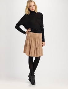 Your favorite cable-knit, soft and cozy in a feminine A-line silhouete.Ribbed waistbandPull-on styleAbout 23 long78% wool/22% nylon/Dry cleanImported