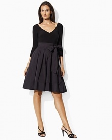 Elegantly pairing sleek matte jersey at the bodice with a lustrous pleated taffeta skirt, an alluring dress is finished with a deep V-neckline and self-tie taffeta sash at the waist for stunning style. Elegantly pairing sleek matte jersey at the bodice with a lustrous pleated taffeta skirt, an alluring dress is finished with a deep V-neckline and self-tie taffeta sash at the waist for stunning style.