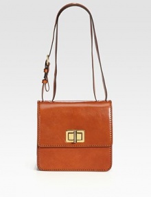 Sleek, sumptuous leather in a structured flap-front silhouette with polished turnlock hardware.Adjustable shoulder straps, 9¾-20 dropTurnlock flap closureOne outside open pocketThree inner compartmentsOne inside zip pocketLeather lining9W X 8H X 3½DMade in Italy Sleek, sumptuous leather in a structured flap-front silhouette with polished turnlock hardware.Adjustable shoulder straps, 9¾-20 dropTurnlock flap closureOne outside open pocketThree inner compartmentsOne inside zip pocketLeather lining9W X 8H X 3½DMade in Italy
