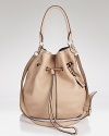 Max Mara proves poised style can be wholly slouchy with this drawstring bucket bag. Boasting luxe leather and rich finishes, it's out-of-the boxy bag accessorizing.