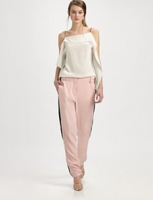 Tailored silk trousers have zippers at each side that adjust to reveal contrast inset panels.Bandless waistBelt loopsZip flySmooth frontWorking zippers at each side seam, from above the knee to the ankleBack besom pocketsRise, about 11Inseam, about 30½SilkDry cleanImported Tailored silk trousers have zippers at each side that adjust to reveal contrast inset panels.Bandless waistBelt loopsZip flySmooth frontWorking zippers at each side seam, from above the knee to the ankleBack besom pocketsRise, about 11Inseam, about 30½SilkDry cleanImported