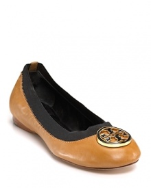 Leather, trimmed with elastic, is topped with gleaming Tory Burch logo medallion, a glam update for the classic ballet flat.