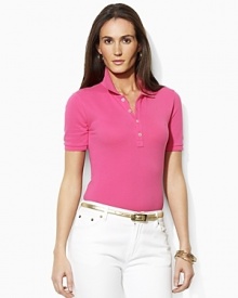 Designed for a trim, body-skimming fit in soft finely ribbed cotton, the iconic polo shirt receives a chic update with gleaming silver-tone metal buttons. Designed for a trim, body-skimming fit in soft finely ribbed cotton, the iconic polo shirt receives a chic update with gleaming silver-tone metal buttons.