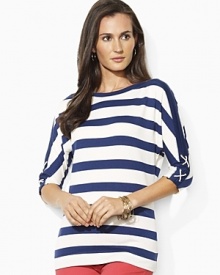 The classic knit tee is given a nautical update with three quarter dolman sleeves that have chic laced detailing.