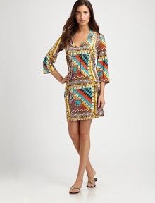 A vibrant tribal print and relaxed-yet-flattering fit makes this one fantastic coverup. Self-tie neckThree-quarter sleevesPull-on style90% polyamide/10% elastaneDry cleanMade in Italy A vibrant tribal print and relaxed-yet-flattering fit makes this one fantastic coverup. Self-tie neckThree-quarter sleevesPull-on style90% polyamide/10% elastaneDry cleanMade in Italy