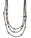 A colorful remix on a stylish classic. Nine West's three-row necklace combines multicolored plastic beads with a hematite-plated mixed metal setting. Approximate length: 18 inches. Approximate drop: 2 inches.