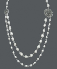 Drape yourself in polished pearls. Genevieve & Grace necklace adds poise with cultured freshwater pearls (4-8 mm) accented by glittering marcasite flowers. Set in sterling silver. Approximate length: 17 inches. Drape yourself in polished pearls. Genevieve & Grace necklace adds poise with cultured freshwater pearls (4-8 mm) accented by glittering marcasite flowers. Set in sterling silver. Approximate length: 17 inches.