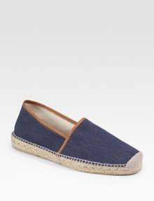 Summertime serenity with a natural look in herringbone cotton canvas, trimmed in leather and finished with sturdy jute detail along the sole. Slip-on style Jute/rubber sole Imported 