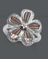 Get fabulous in florals. This chic, blooming flower features a sterling silver setting with 14k rose gold accents and round-cut diamonds at the petals and center (1/8 ct. t.w.). Size 7.