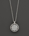 Diamond cluster pendant necklace in 14K white gold.